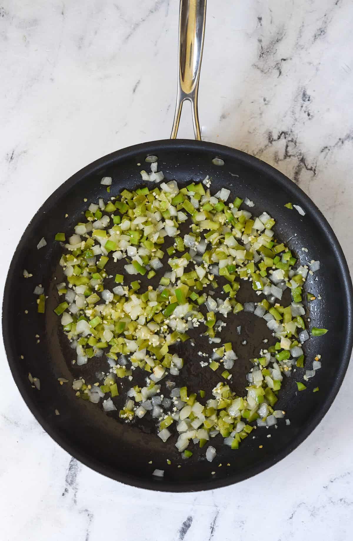 green peppers, onion and garlic sauteed in skillet