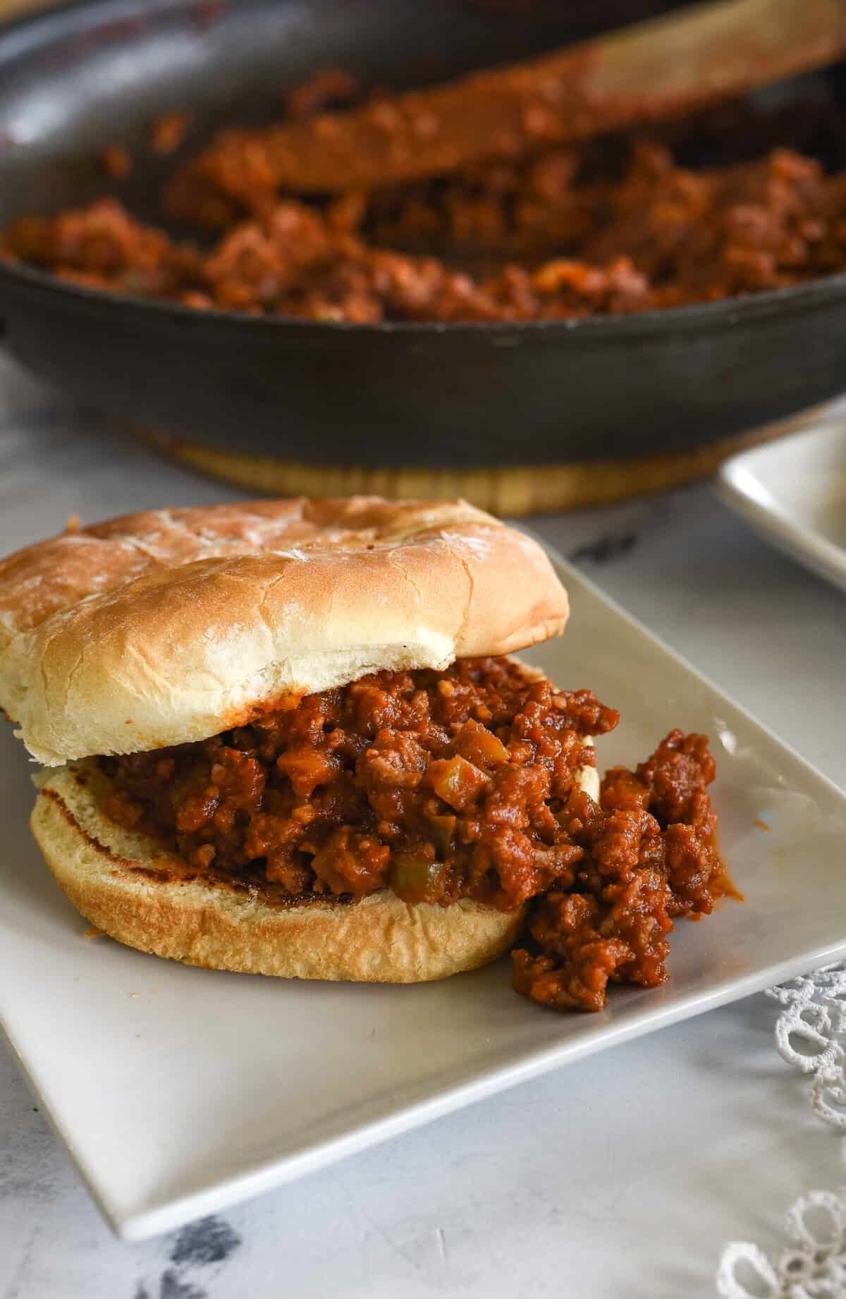 sloppy joes mixture on bun on plate