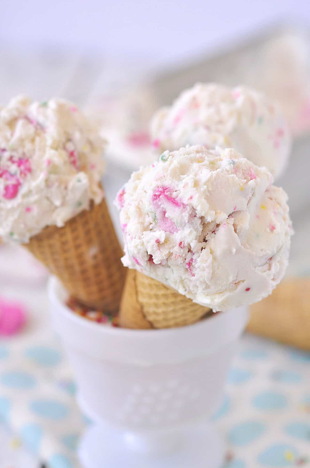 3 ice cream cones in a dish with circus animal ice cream