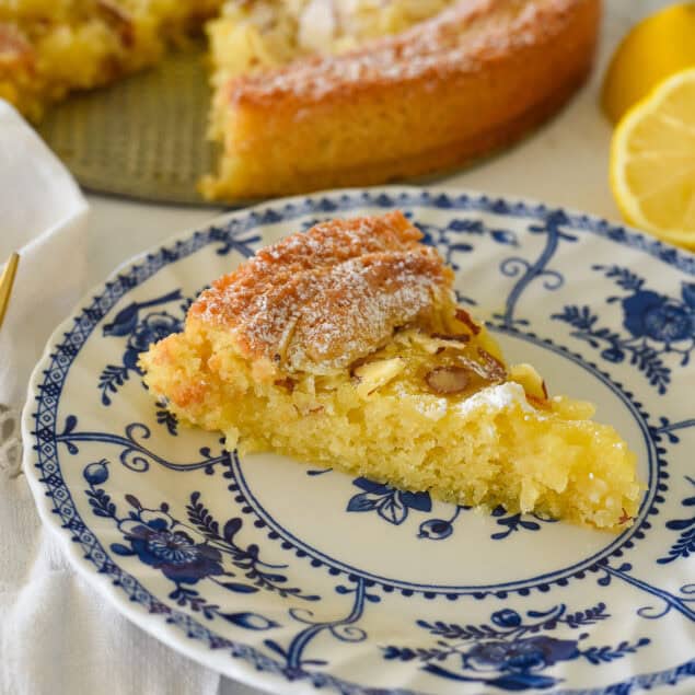lemon almond butter cake slice on a plate