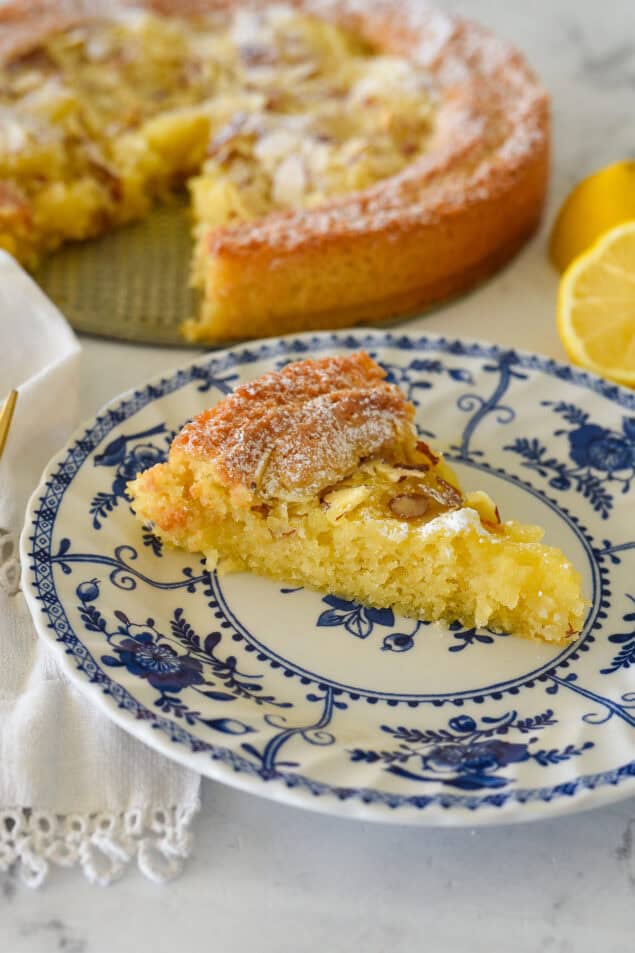 lemon almond butter cake slice on a plate