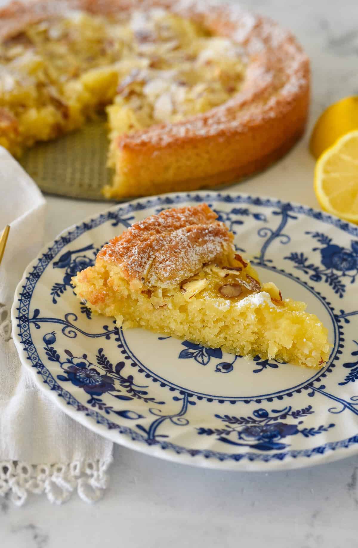 lemon almond butter cake slice on a plate