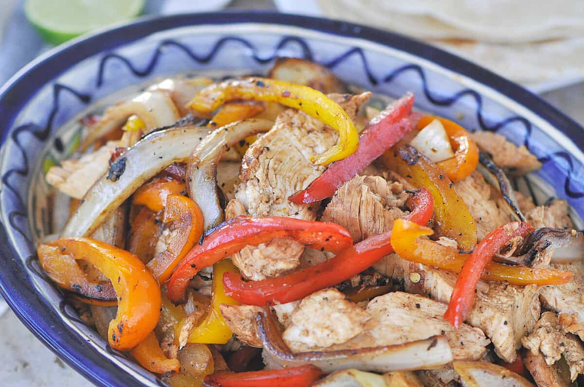 overhead shot of chicken fajitas in a bowl