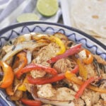 sliced chicken and peppers in a bowl