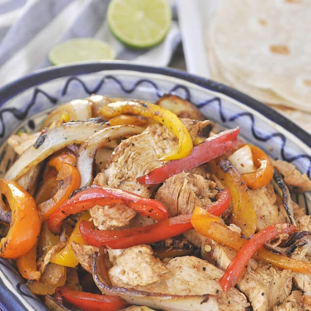 sliced chicken and peppers in a bowl