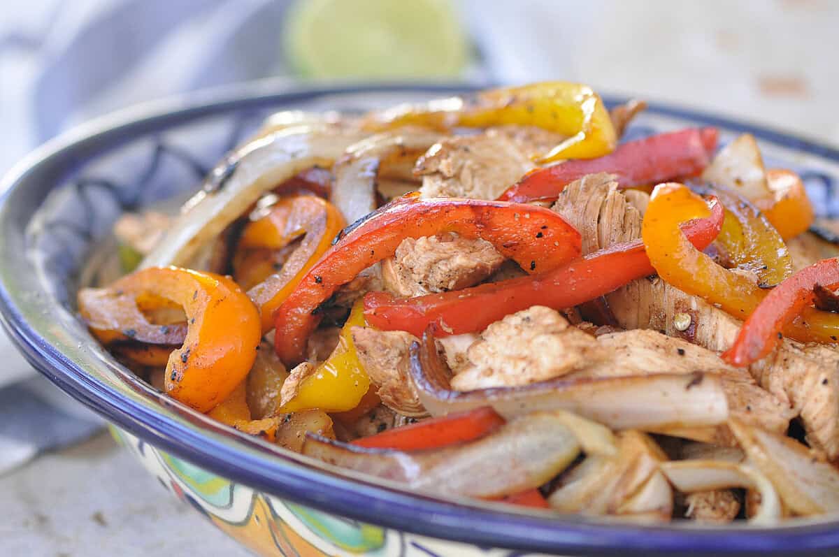 chicken fajita recipe chicken fajitas and peppers in a mexican bowl