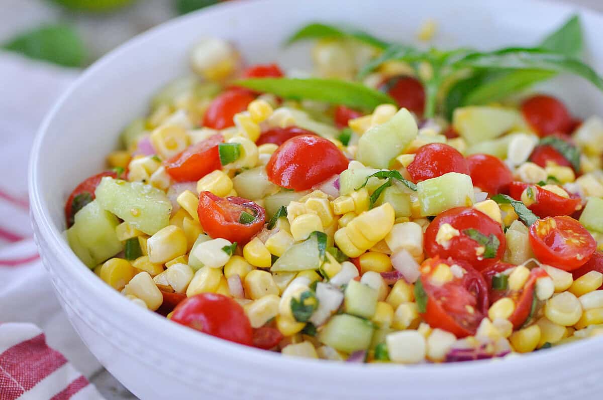 closeup of corn salad in a white bowl