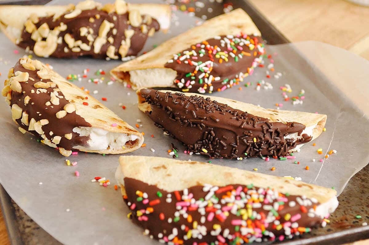ice cream taco recipe ice cream tacos with chocolate and sprinkles on a sheet pan