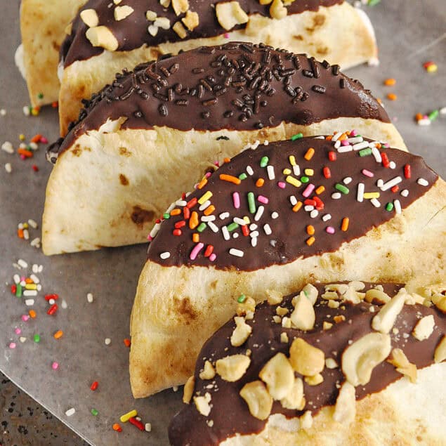 ice cream tacos lined up on a baking sheet