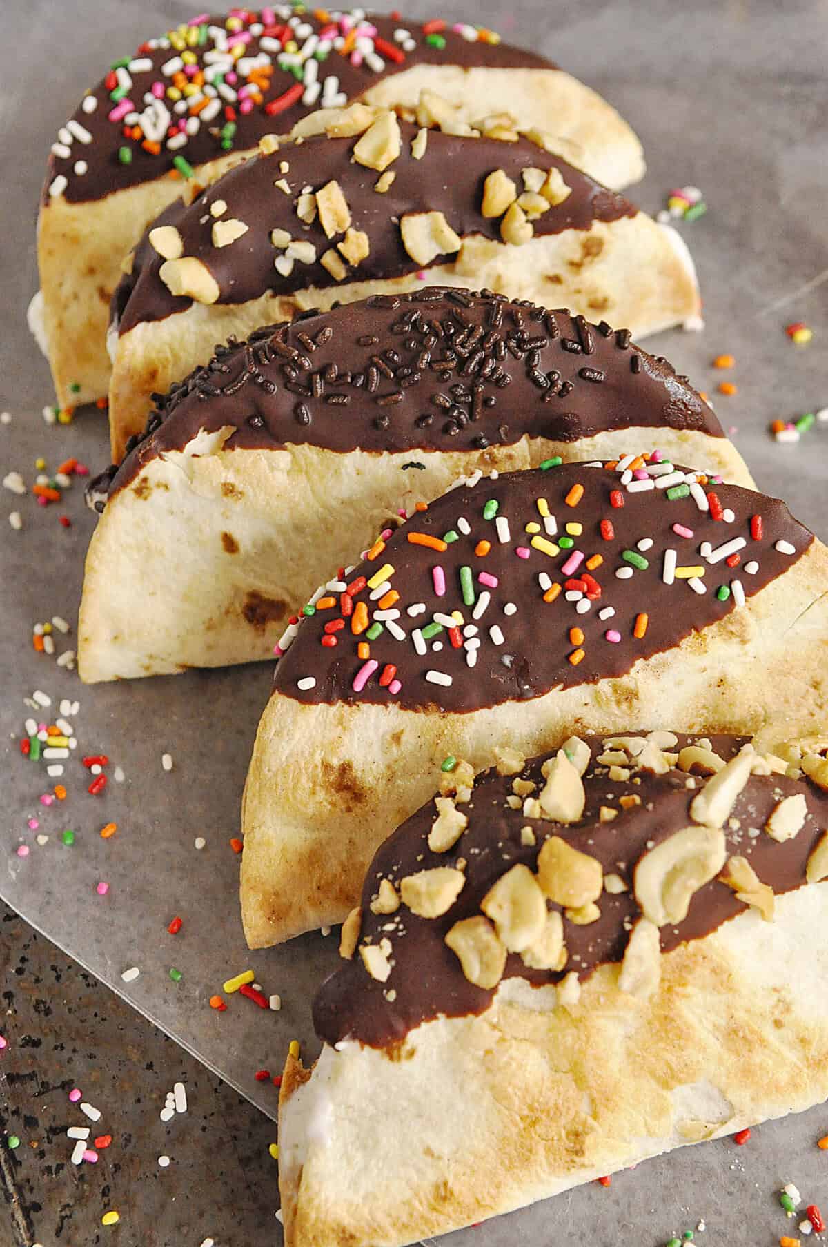 ice cream tacos lined up on a baking sheet