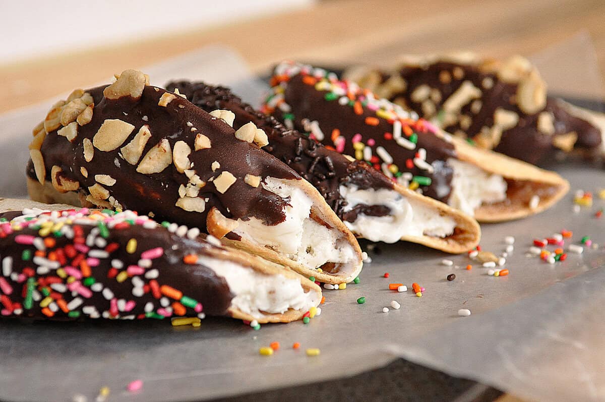chocolate dipped ice cream tacos with sprinkles on top
