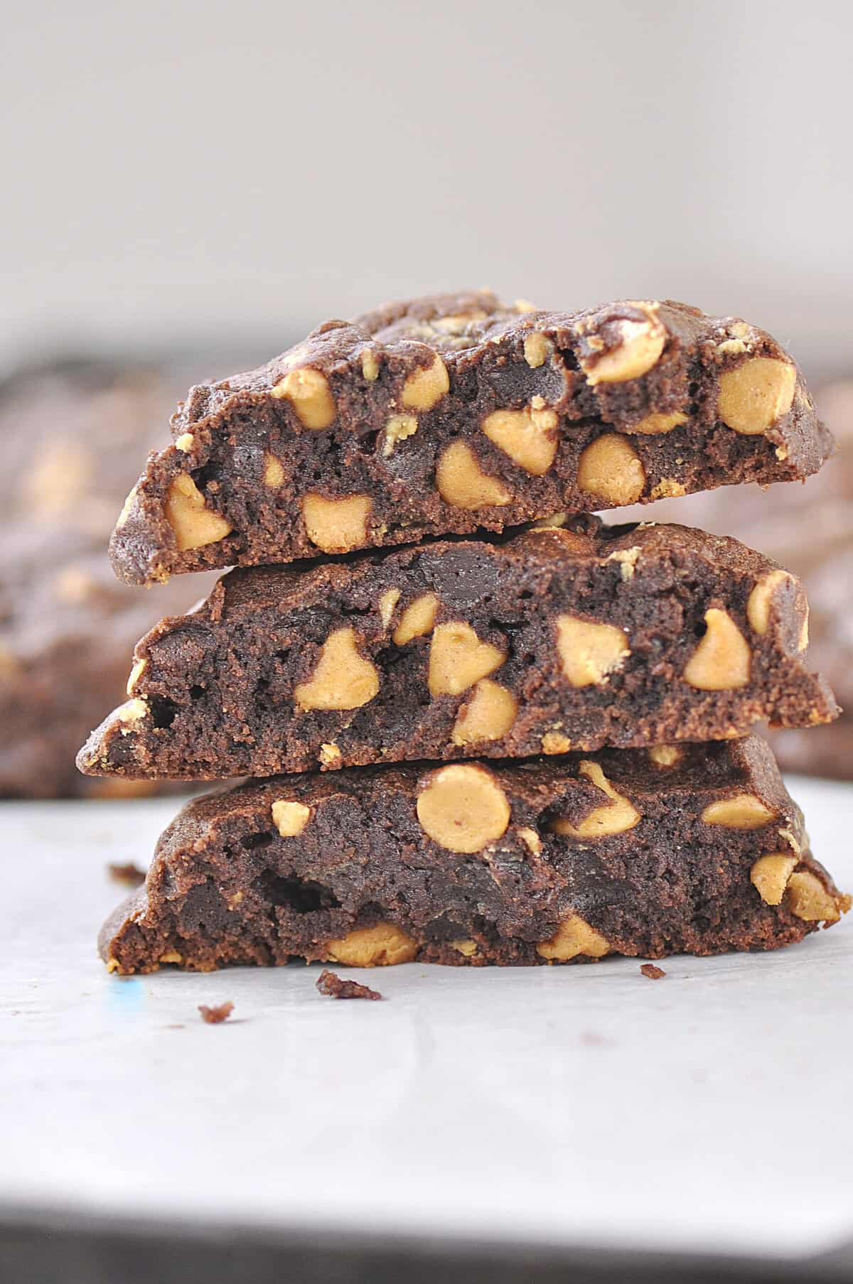 chocolate peanut butter chip cookies stack of three cookies cut in half - peanut butter chocolate chip cookies