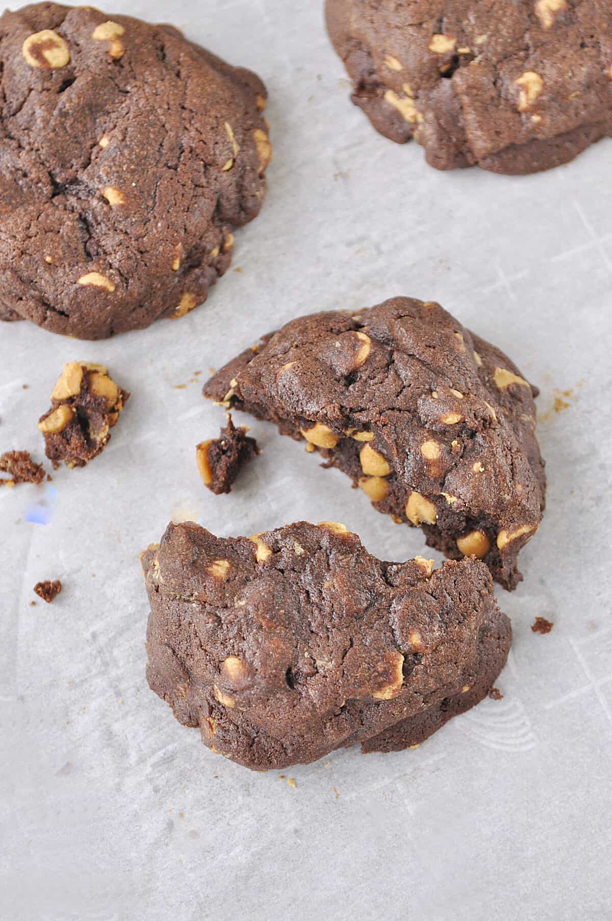 overhead shot of a peanut butter chocolate chip cookie cut in half