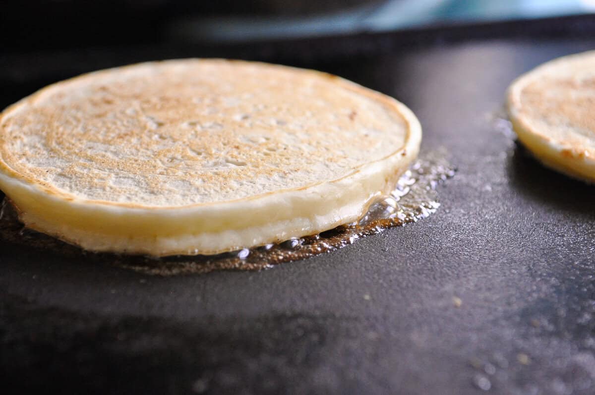 pancake on a griddle cooking