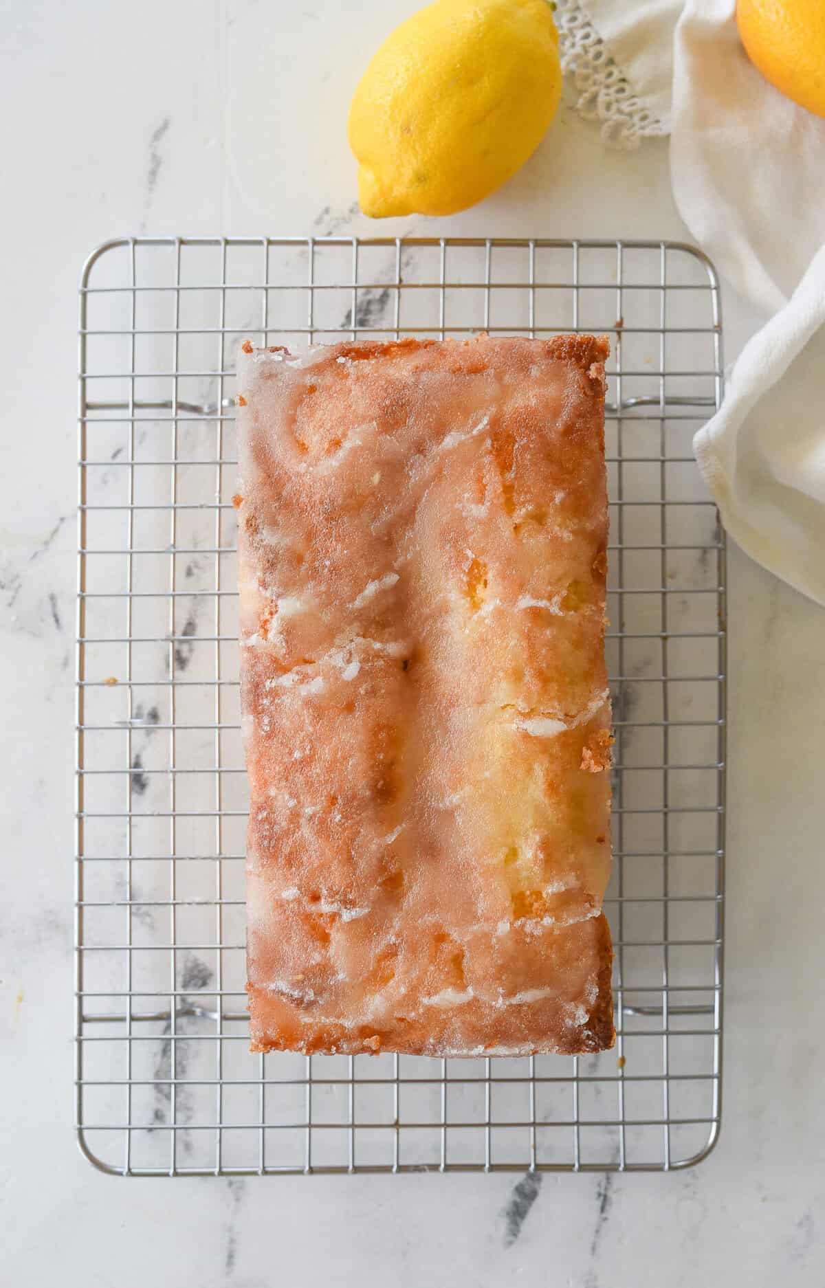 lemon drizzle cake cooling on a rack