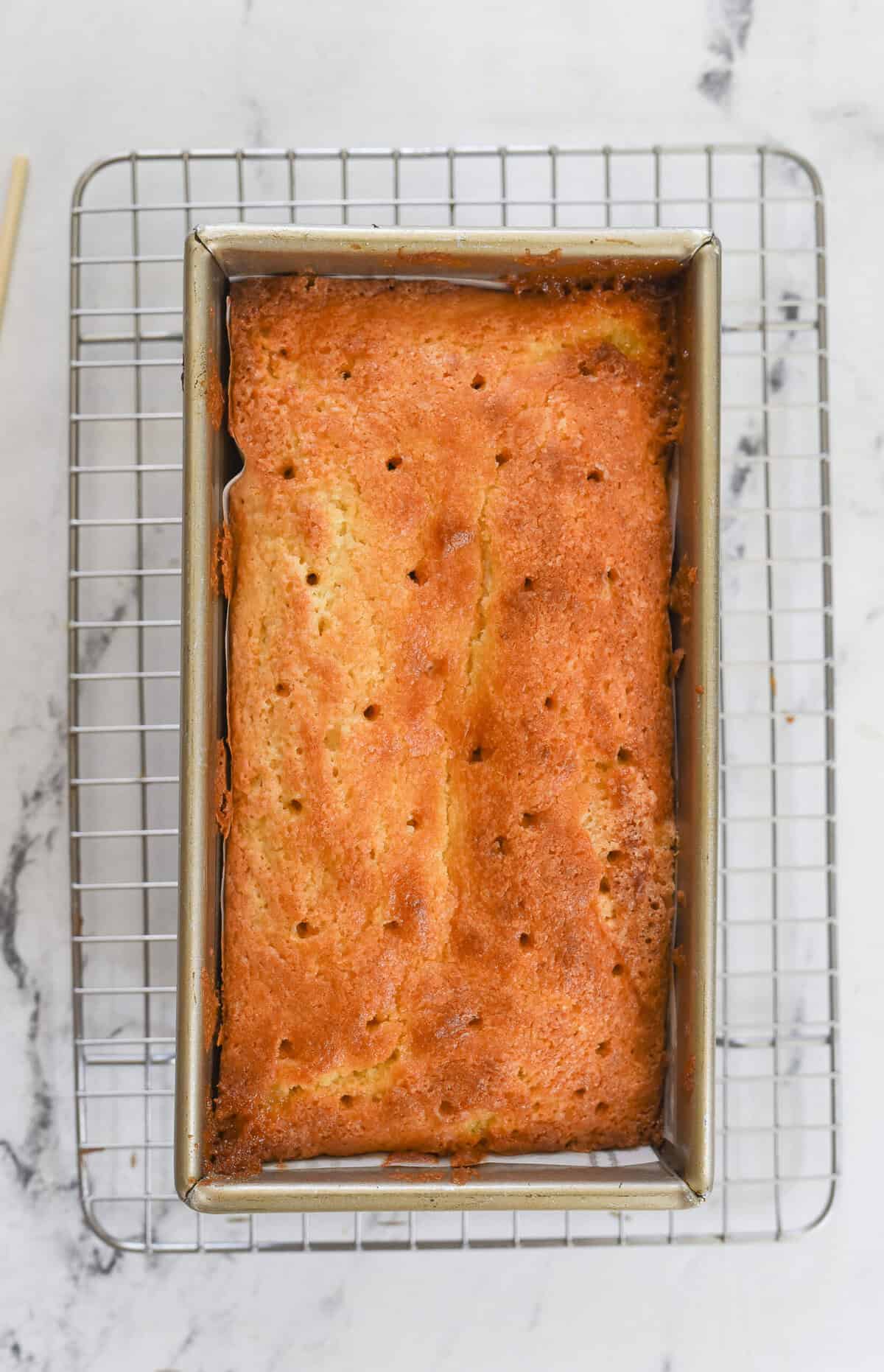 lemon drizzle cake poked with holes