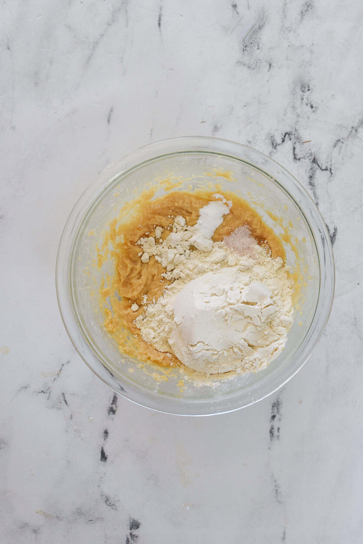 adding dry ingredients into cookie dough