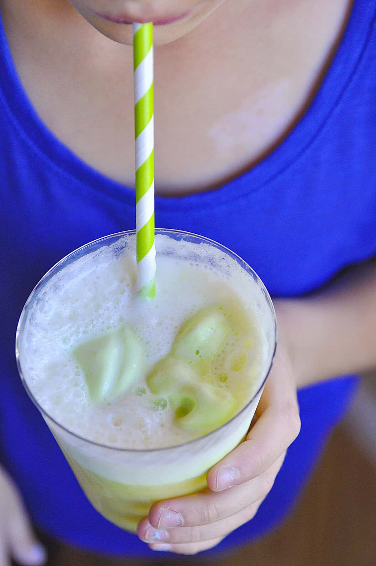 closeup shot of witch's brew in a cup with a straw
